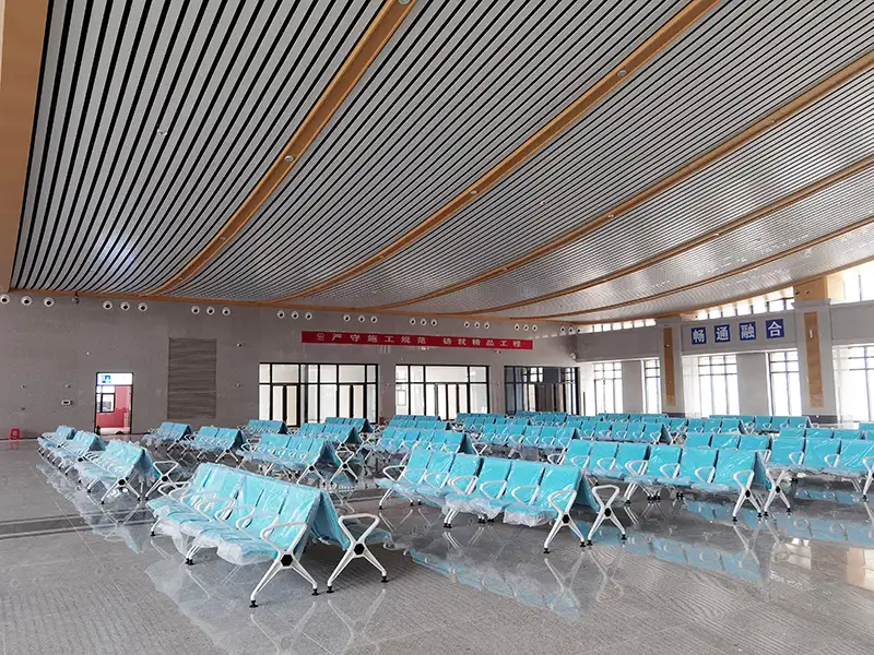 FLYA high-speed rail station waiting chairs installed at Badong railway station departure hall with PU cushions for passenger comfort.