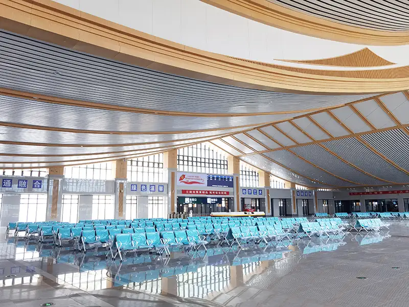 FLYA high-speed rail station waiting chairs installed at Badong railway station departure hall with PU cushions for passenger comfort.