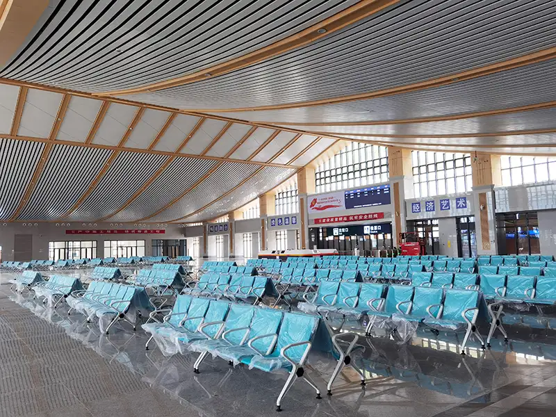 FLYA high-speed rail station waiting chairs installed at Badong railway station departure hall with PU cushions for passenger comfort.