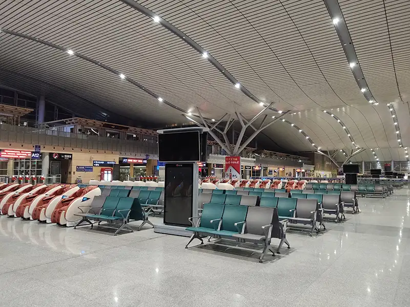FLYA public seating at changsha airport transit lounge with comfortable lounge chairs and resting beds for layover passengers