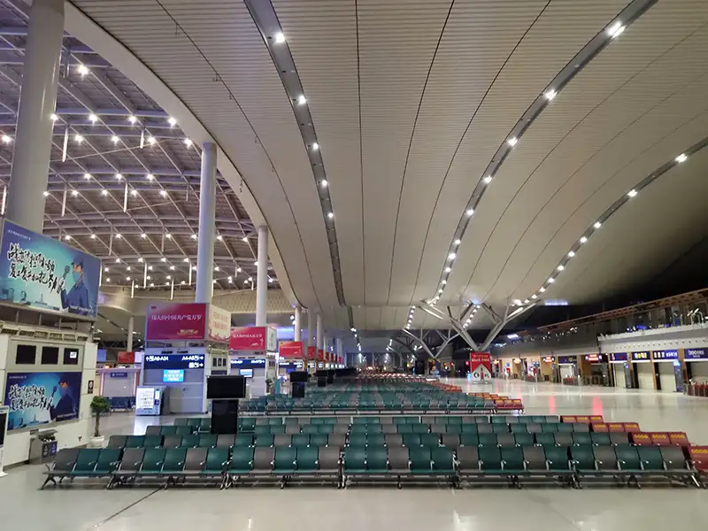 FLYA public seating at changsha airport transit lounge with comfortable lounge chairs and resting beds for layover passengers