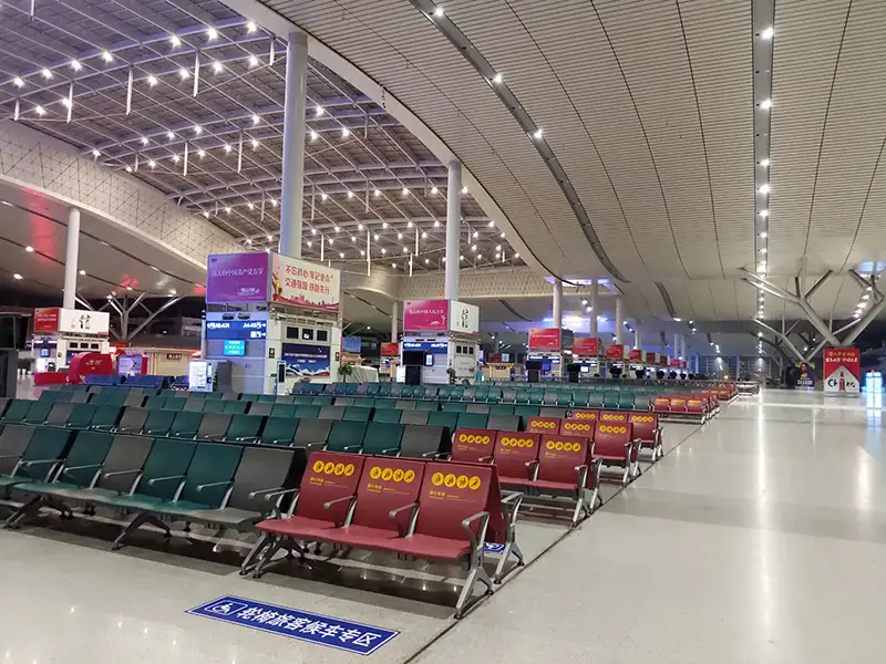 FLYA public seating at changsha airport transit lounge with comfortable lounge chairs and resting beds for layover passengers