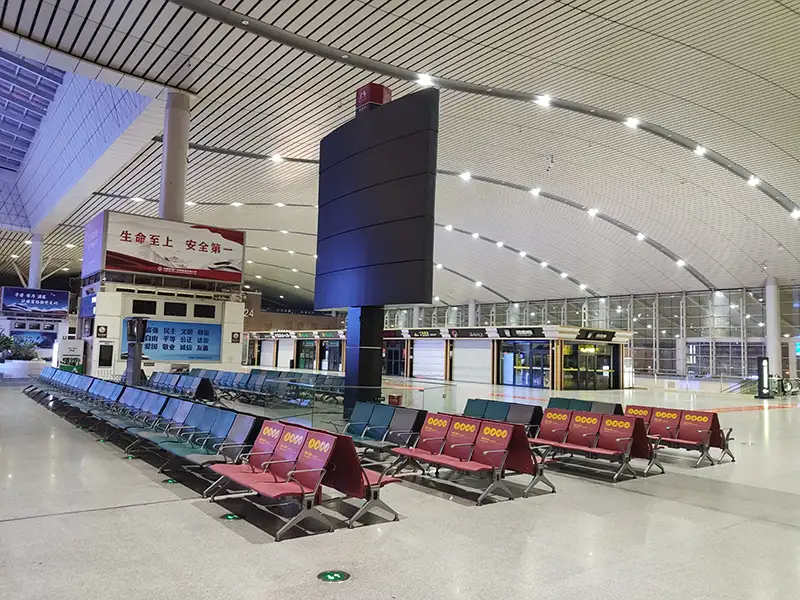 FLYA public seating at changsha airport transit lounge with comfortable lounge chairs and resting beds for layover passengers
