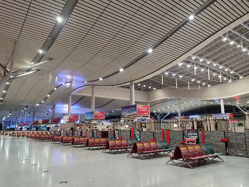 FLYA public seating at changsha airport transit lounge with comfortable lounge chairs and resting beds for layover passengers