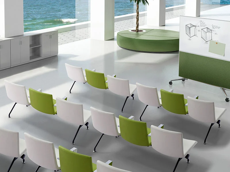 Three-seater leather waiting bench without armrests and tufted backrest, elegant corporate reception seating for office lobbies and executive areas.
