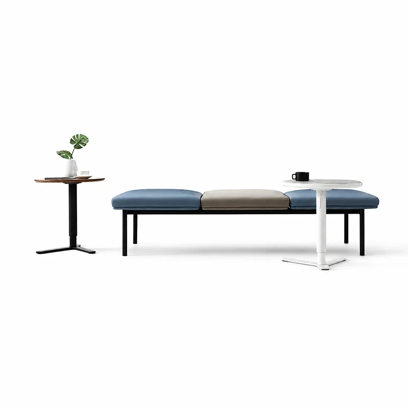 Three-seater fabric waiting bench without armrests and tufted backrest, elegant corporate reception seating for office lobbies and executive areas.