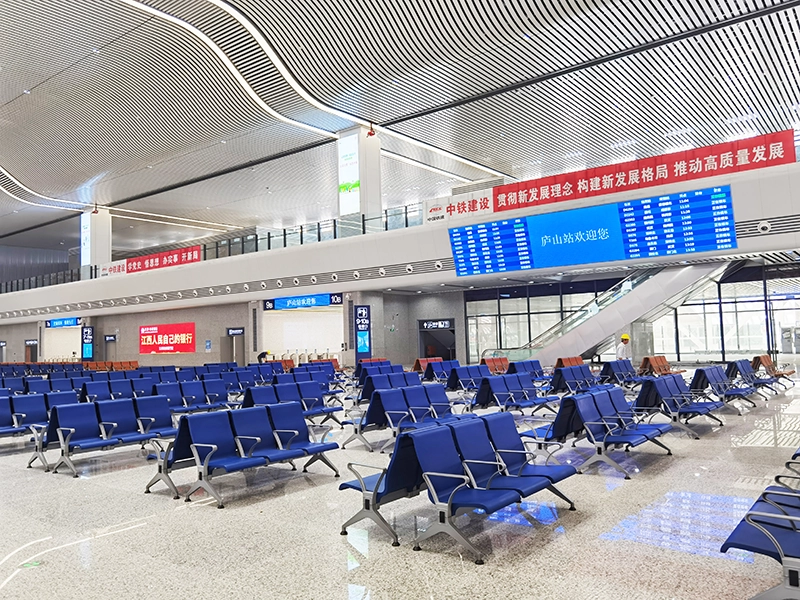Blue cushion airport waiting chair 3 seater for easy visual guidance in large hall.