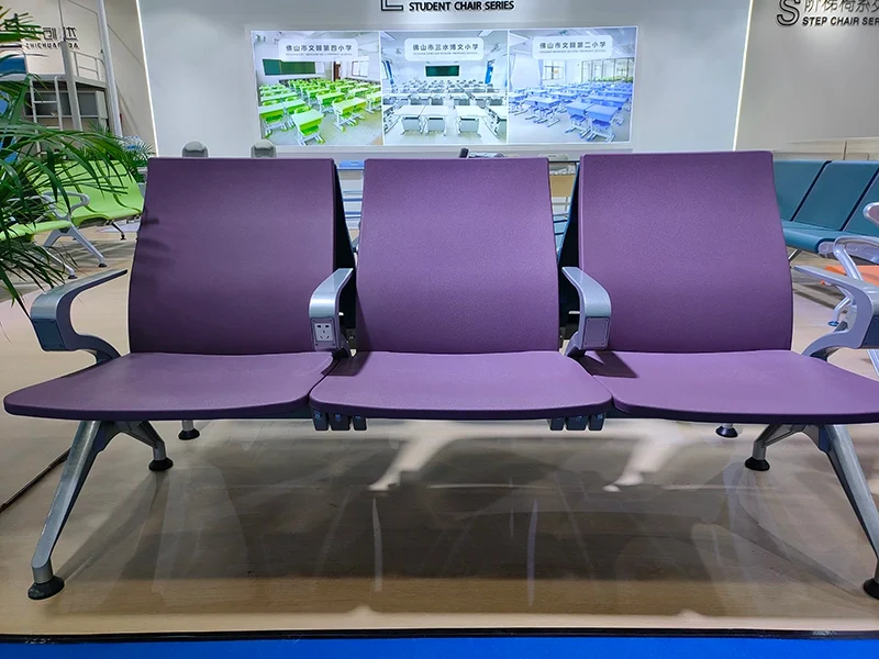 Extra wide seat airport chair for plus size passenger comfort in transit area.
