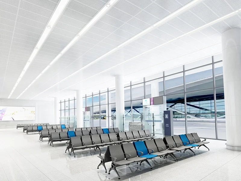 Extra wide seat airport chair for plus size passenger comfort in transit area.