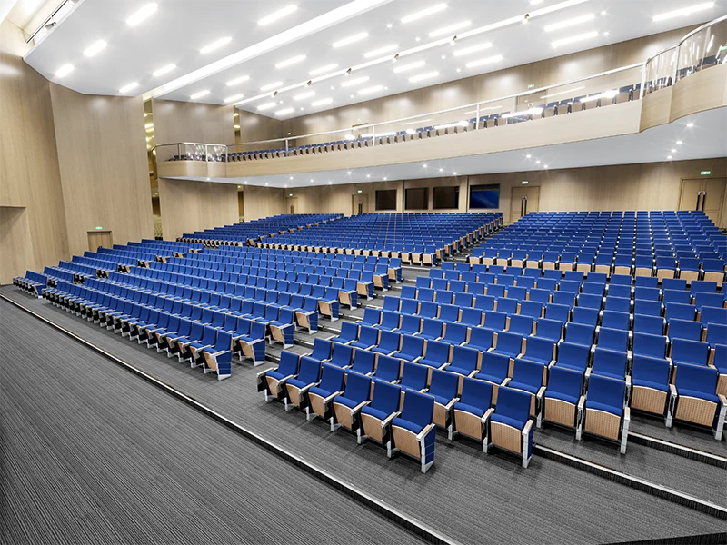 auditorium-chair-blue-fabric Auto tipping up auditorium chair for easy cleaning between cinema showtimes.
