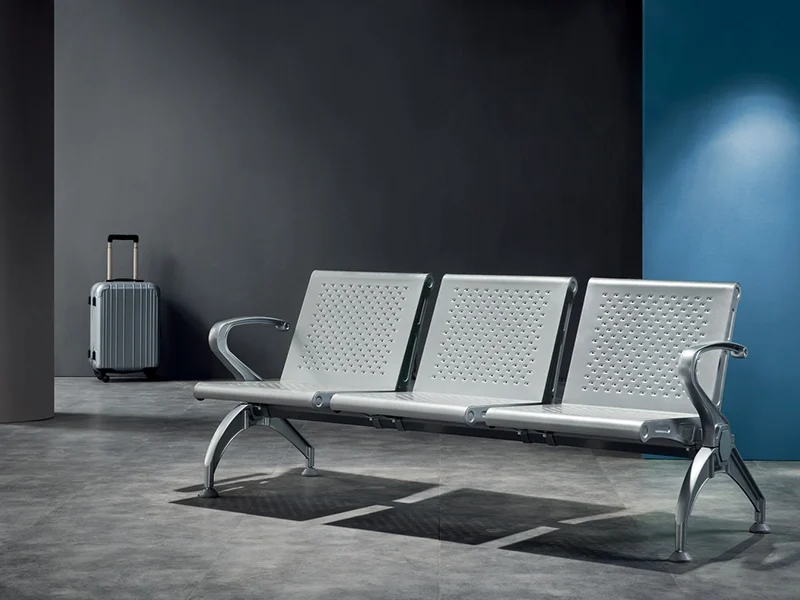 Stainless steel bus station bench for modern transit center aesthetic.
