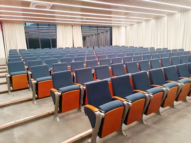 Auditorium chair with folding system for space saving in multi purpose hall and school.