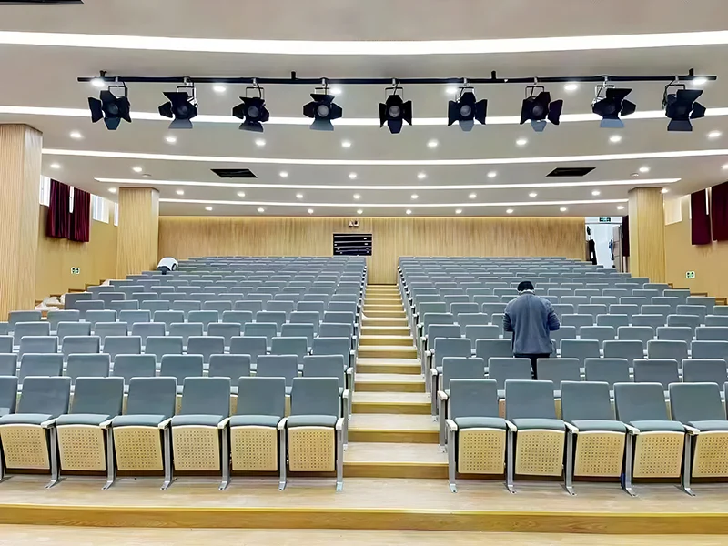 Auditorium chair with folding system for space saving in multi purpose hall and school.