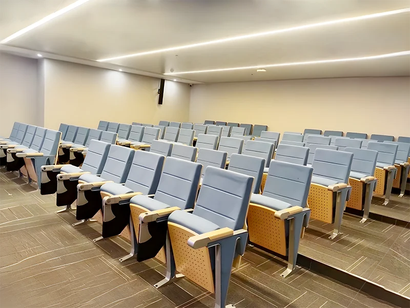 Auditorium chair with folding system for space saving in multi purpose hall and school.