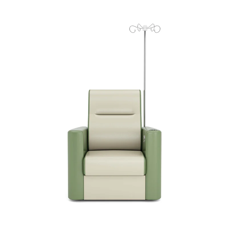 hospital recliner chair installed in a standard treatment room with space for iv stand and vital monitor.
