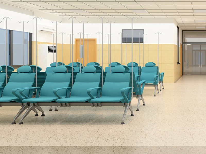 medical recliner showing contoured headrest support for cervical comfort during long infusions.